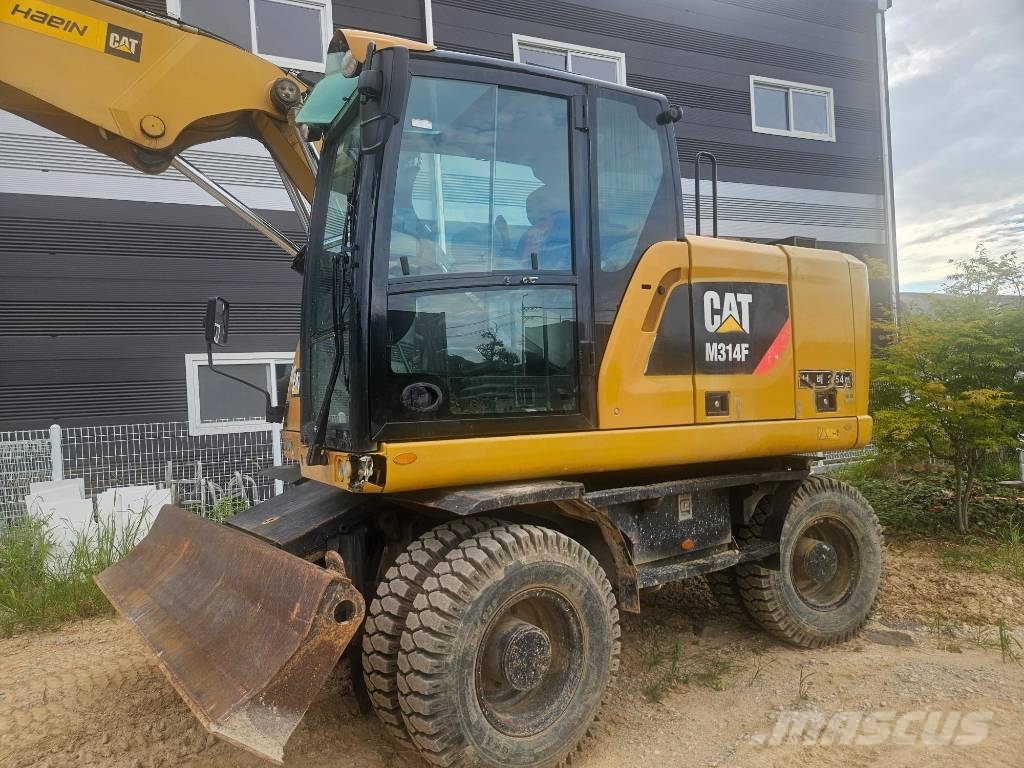 CAT M314F حفارات بعجل