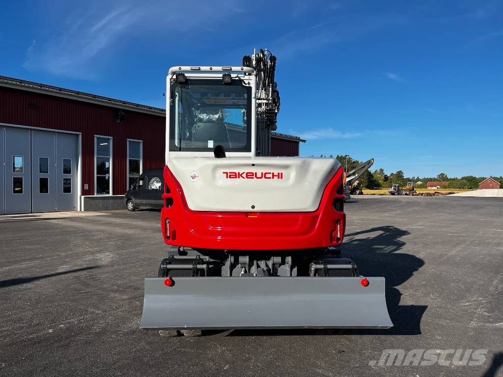 Takeuchi TB 370 W حفارات بعجل