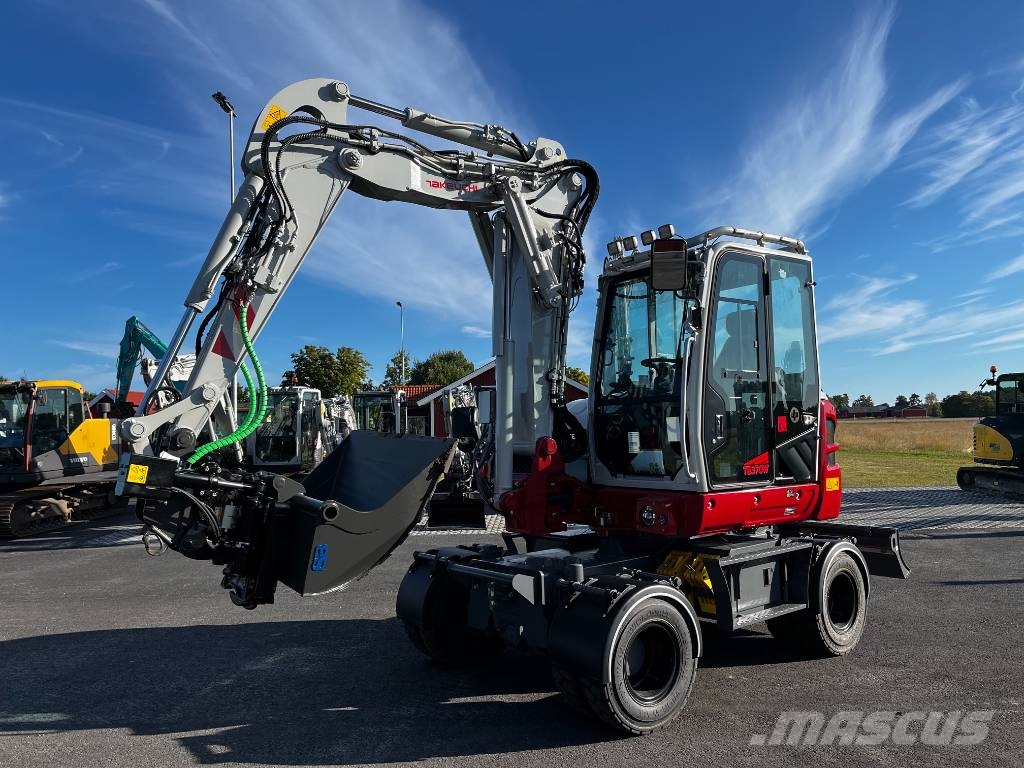 Takeuchi TB 370 W حفارات بعجل