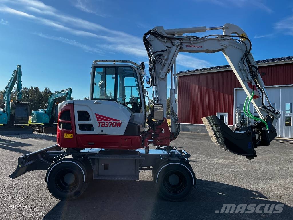 Takeuchi TB 370 W حفارات بعجل