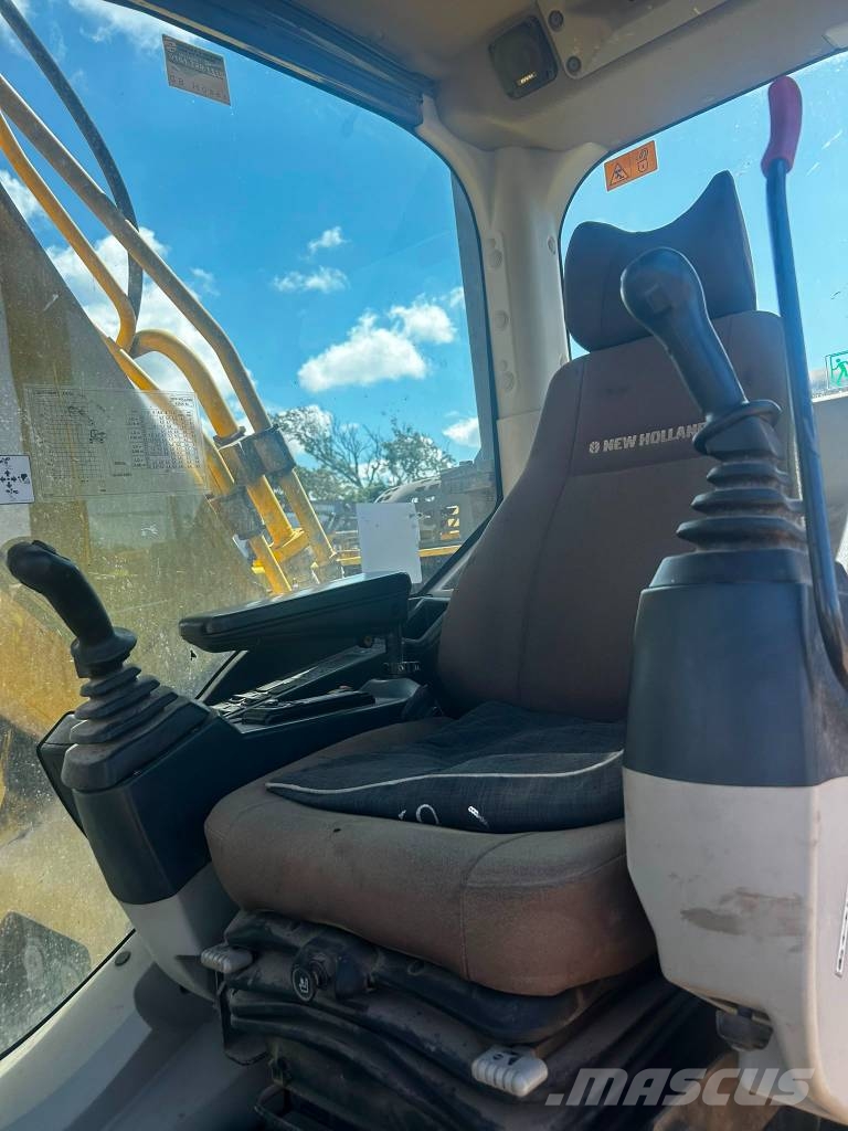 New Holland E 265 C Rupsgraafmachines