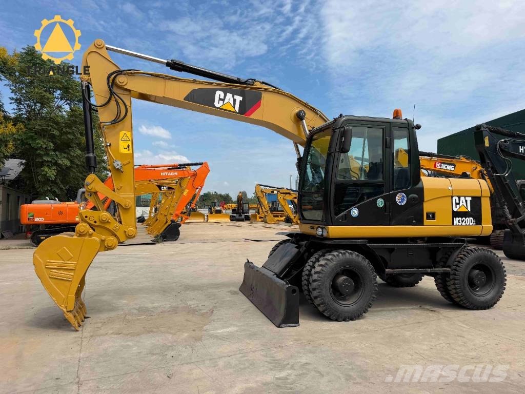 CAT M 320 Bagri na kolesih