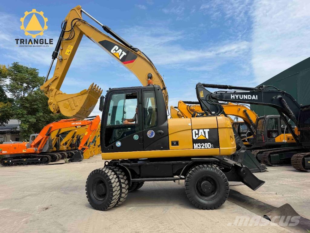 CAT M 320 Bagri na kolesih