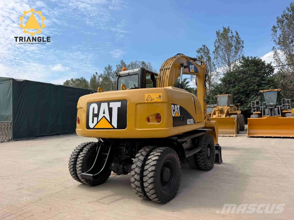 CAT M 320 Bagri na kolesih