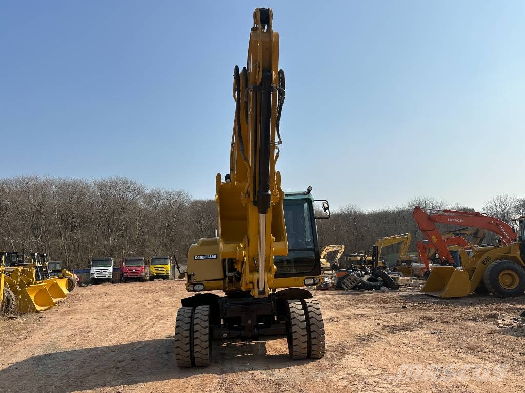CAT M320D Bagri na kolesih