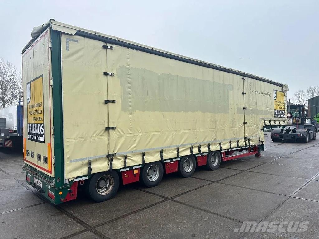 Meusburger 4 AXLE STEERING - DOUBLE EXTENDABLE UP TO 28 M - E نصف مقطورة مسطحة منخفضة