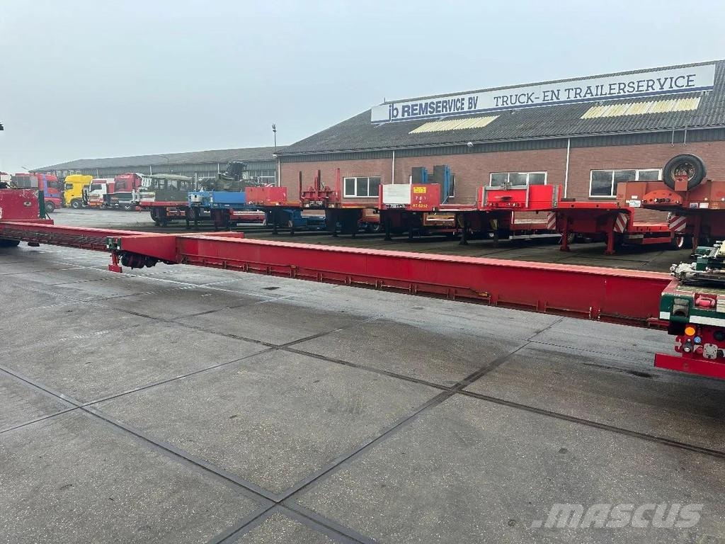 Meusburger 4 AXLE STEERING - DOUBLE EXTENDABLE UP TO 28 M - E نصف مقطورة مسطحة منخفضة