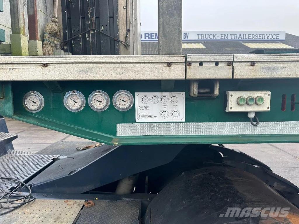 Meusburger 4 AXLE STEERING - DOUBLE EXTENDABLE UP TO 28 M - E نصف مقطورة مسطحة منخفضة