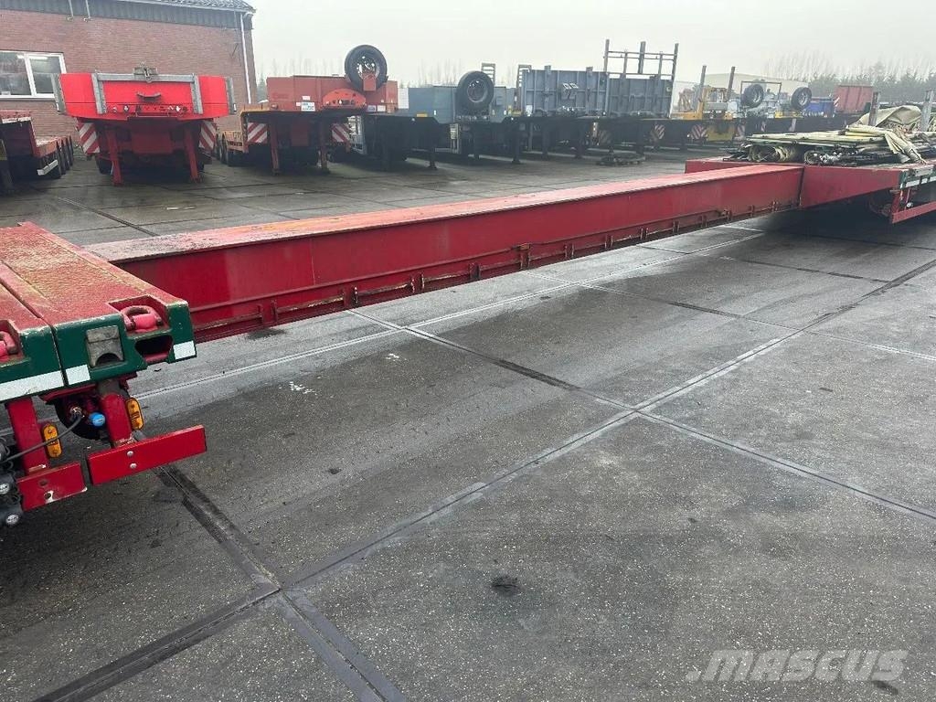 Meusburger 4 AXLE STEERING - DOUBLE EXTENDABLE UP TO 28 M - E نصف مقطورة مسطحة منخفضة