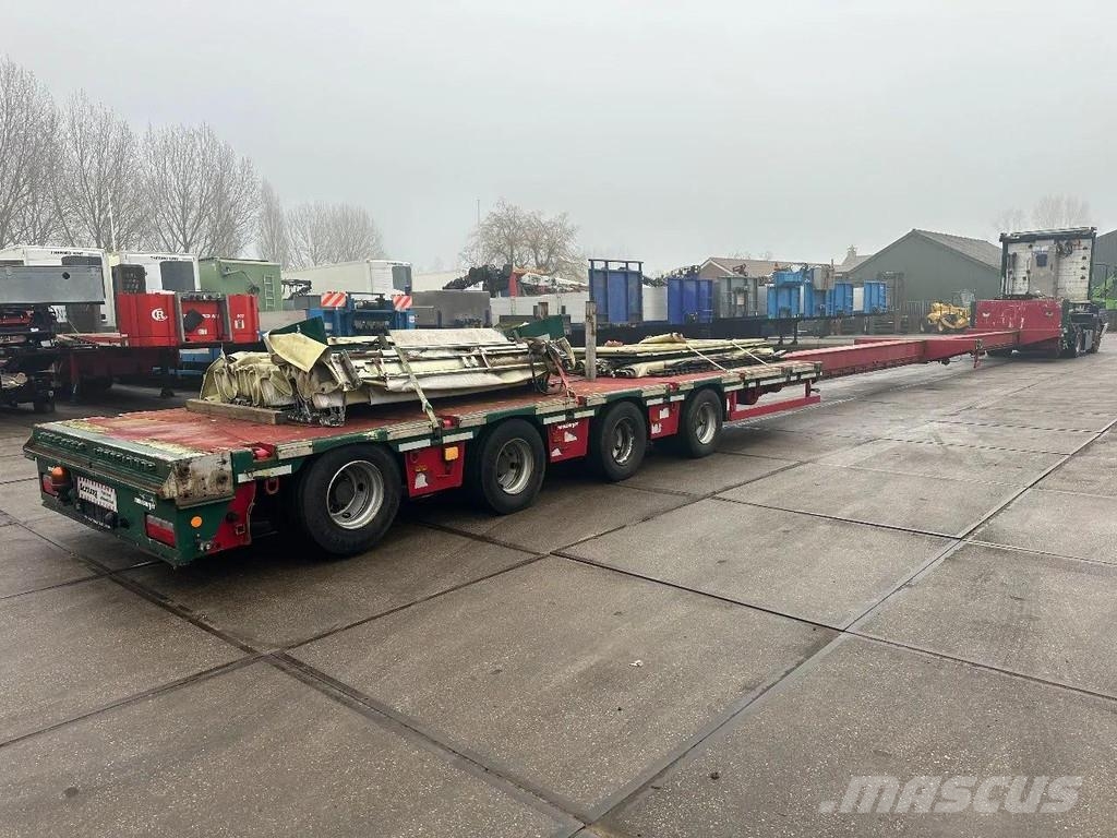 Meusburger 4 AXLE STEERING - DOUBLE EXTENDABLE UP TO 28 M - E نصف مقطورة مسطحة منخفضة