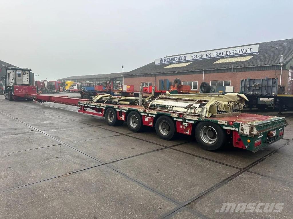 Meusburger 4 AXLE STEERING - DOUBLE EXTENDABLE UP TO 28 M - E نصف مقطورة مسطحة منخفضة