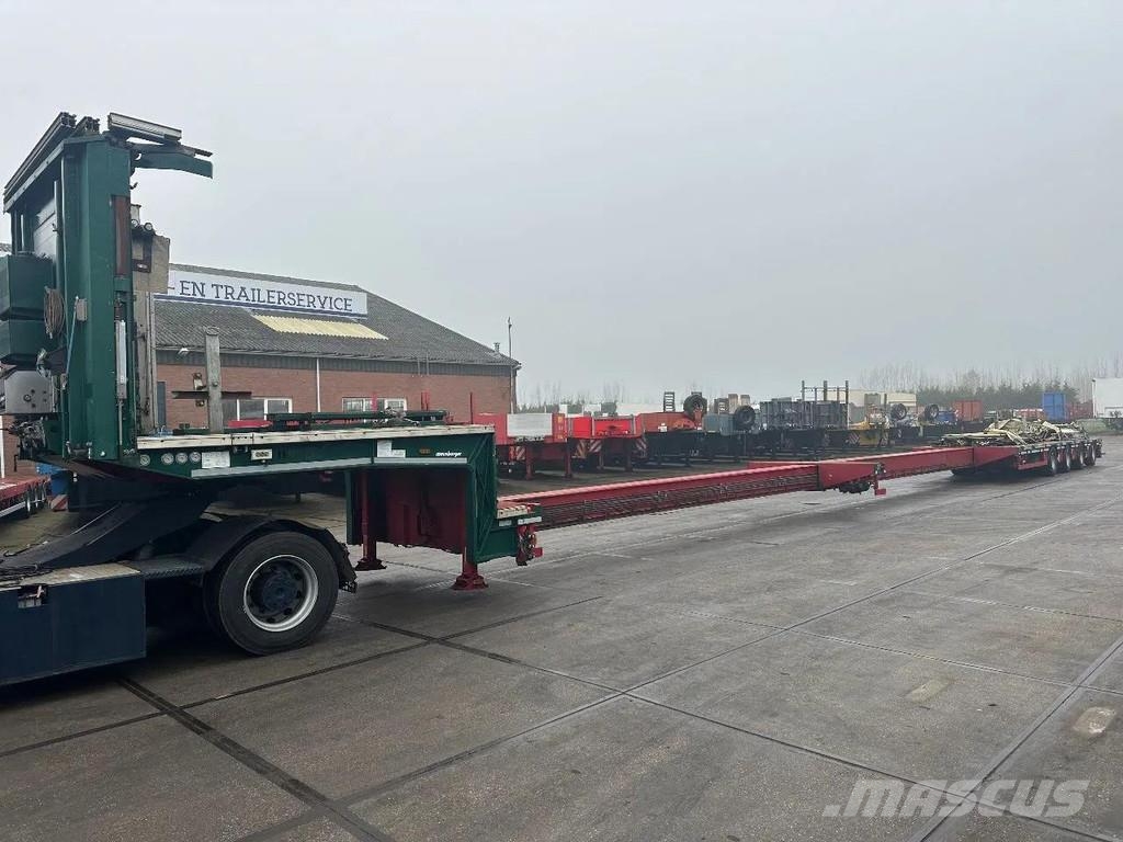 Meusburger 4 AXLE STEERING - DOUBLE EXTENDABLE UP TO 28 M - E نصف مقطورة مسطحة منخفضة
