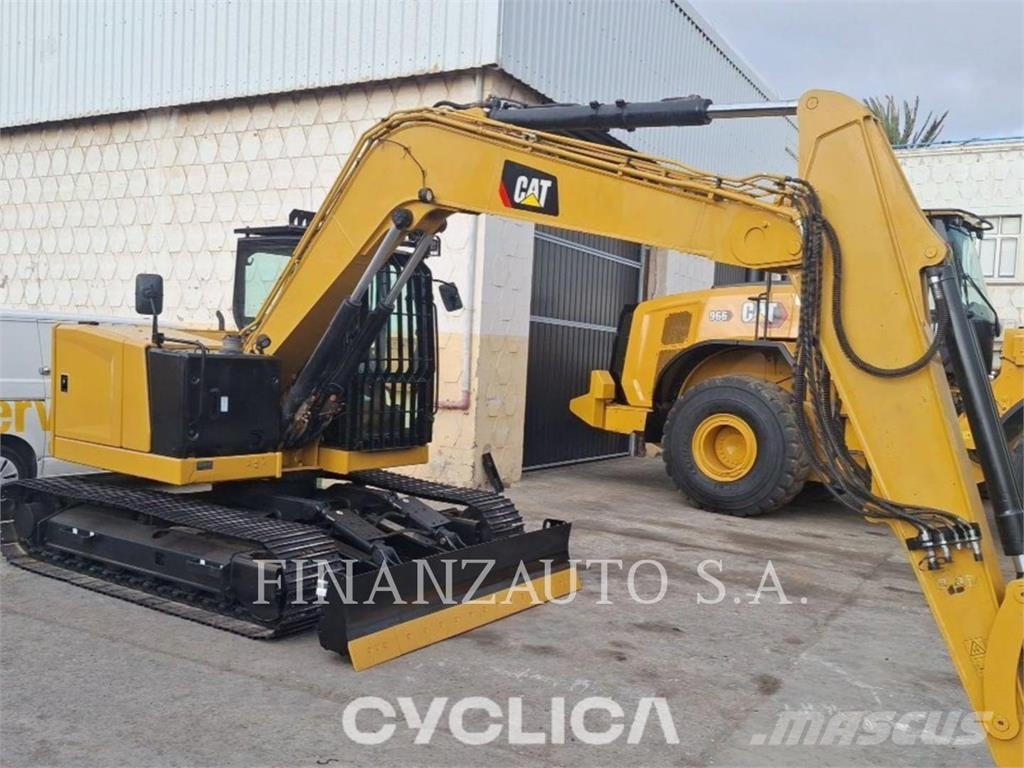 CAT 310 Rupsgraafmachines