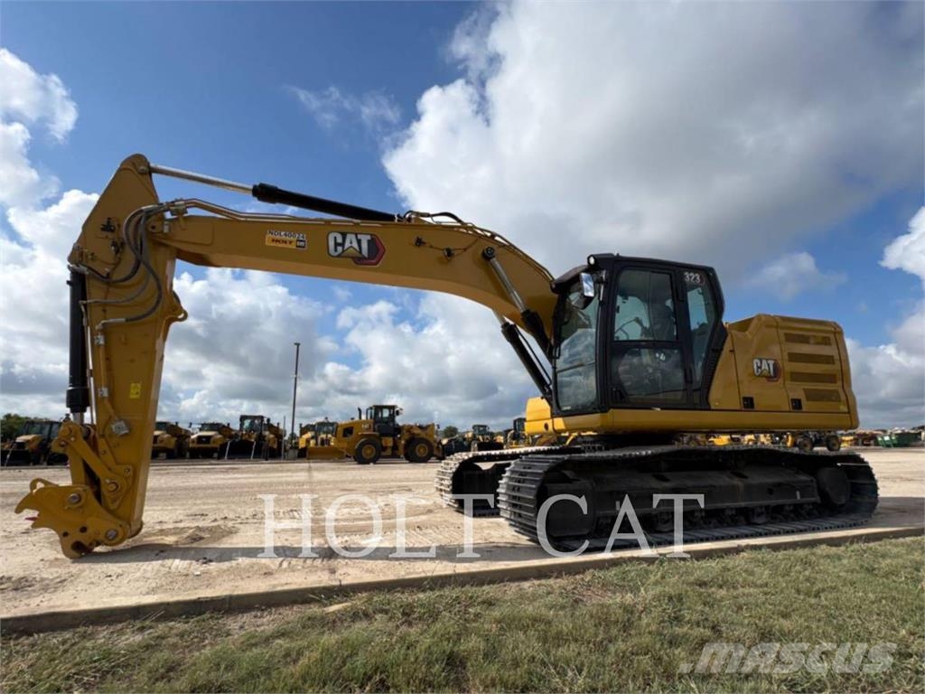 CAT 323 TC Kolesni nakladalci