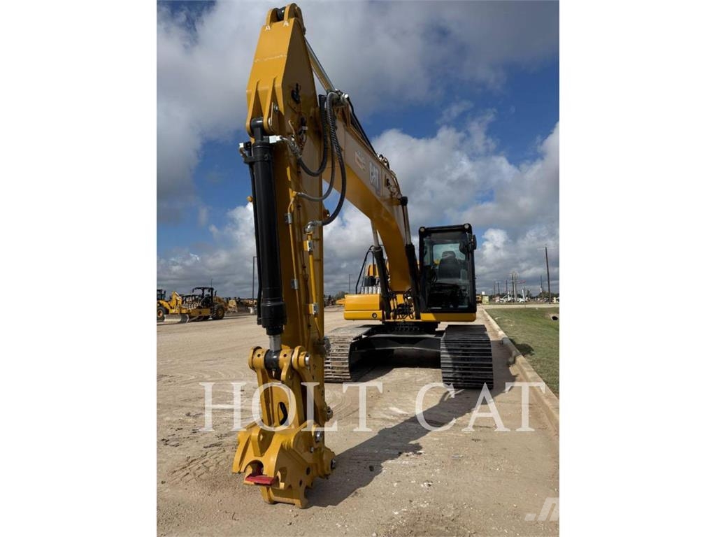 CAT 323 TC Kolesni nakladalci