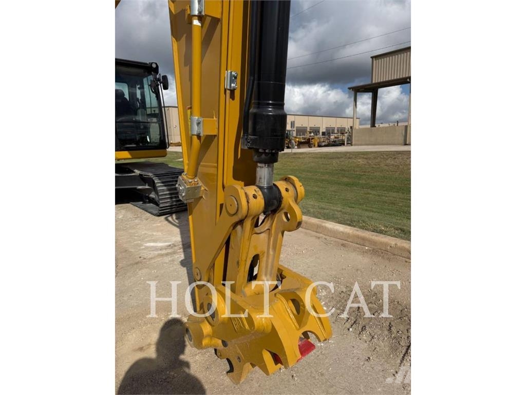 CAT 323 TC Kolesni nakladalci