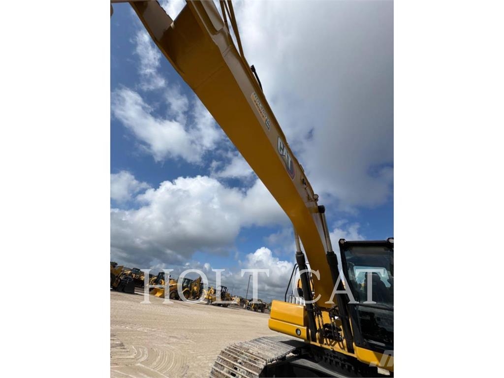 CAT 323 TC Kolesni nakladalci