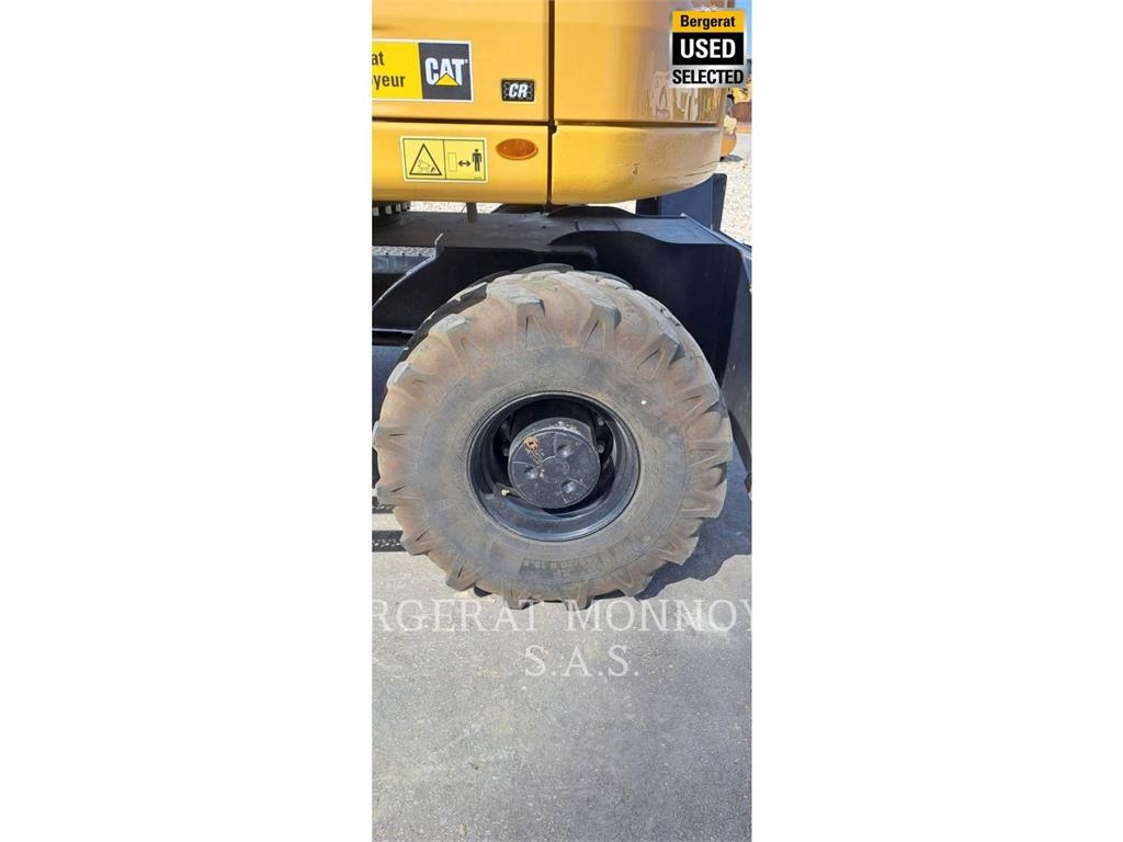 CAT M315 Pelle sur pneus