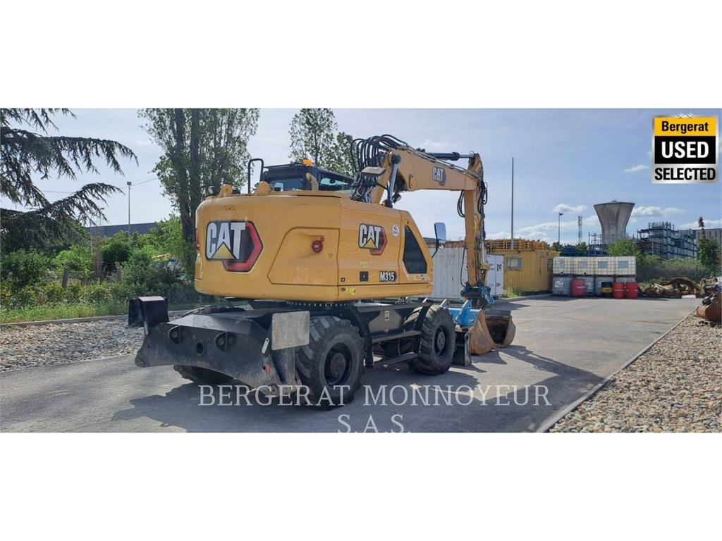 CAT M315 Pelle sur pneus