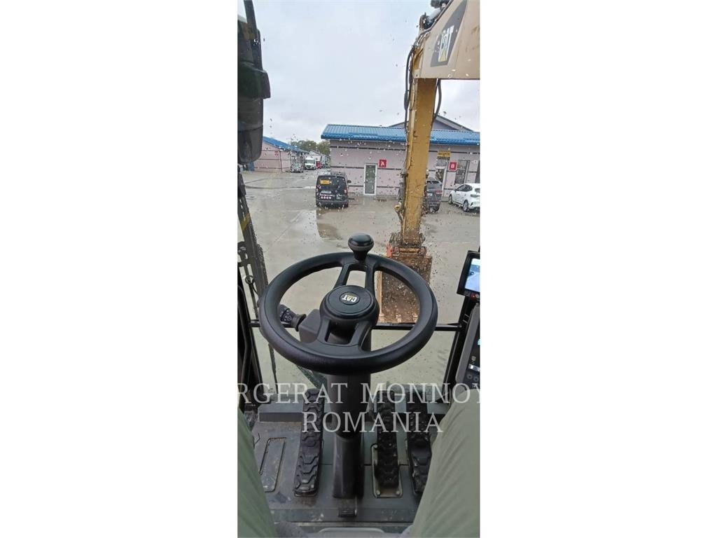 CAT M318F Pelle sur pneus
