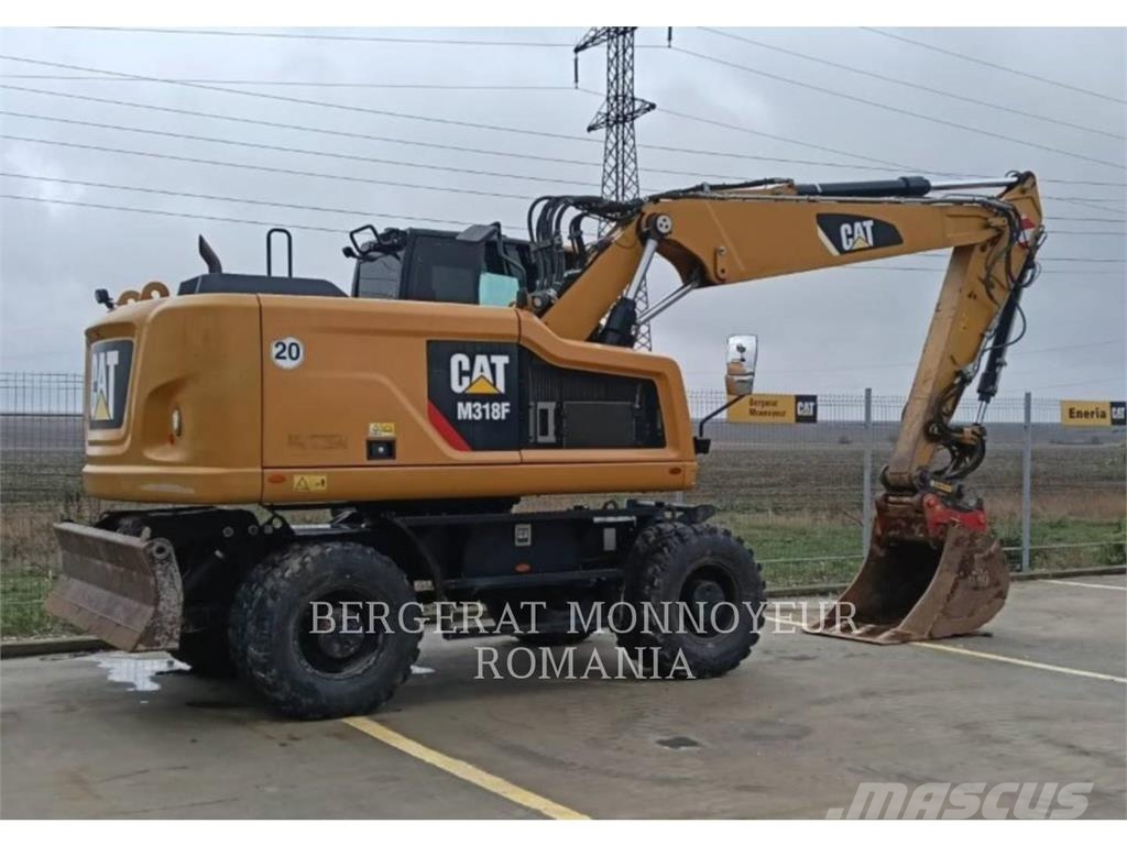 CAT M318F Pelle sur pneus
