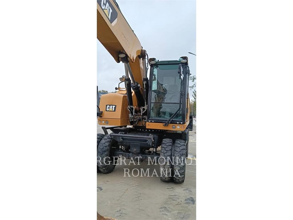 CAT M318F Pelle sur pneus