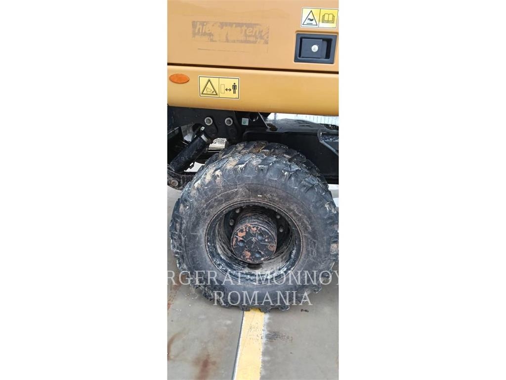 CAT M318F Pelle sur pneus