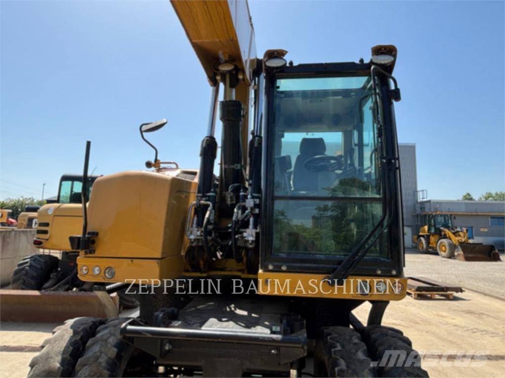 CAT M320F Gumikerekes kotrók
