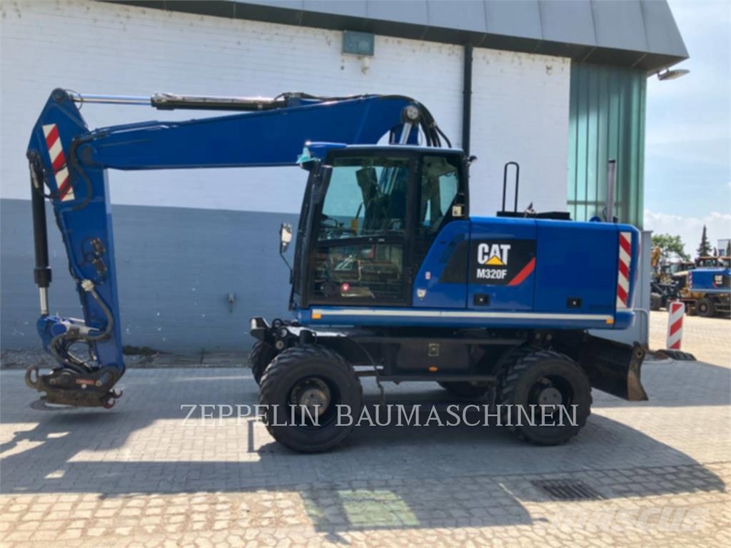 CAT M320F Bagri na kolesih
