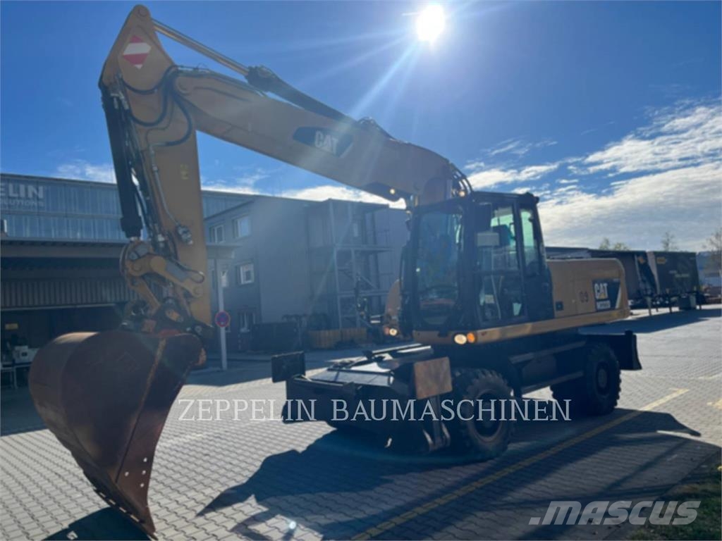 CAT M322D Ekskavatori uz riteņiem