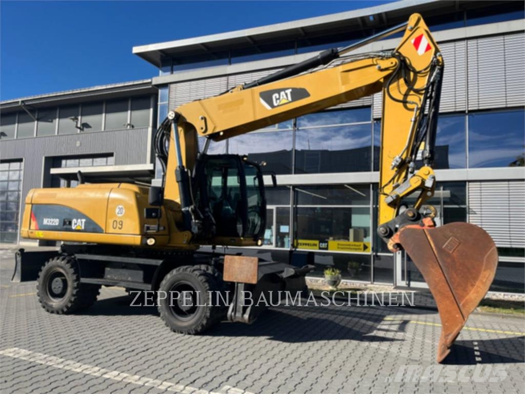 CAT M322D Ekskavatori uz riteņiem