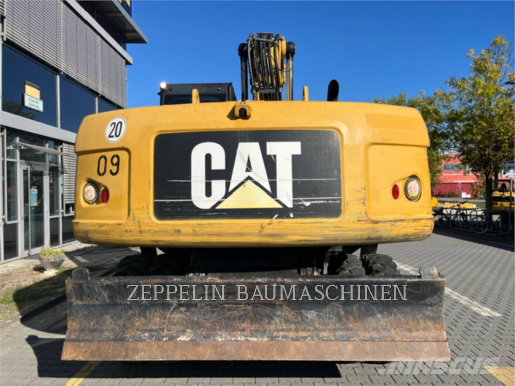 CAT M322D Ekskavatori uz riteņiem