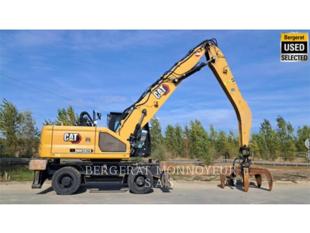 CAT MH3024 Pelle sur pneus