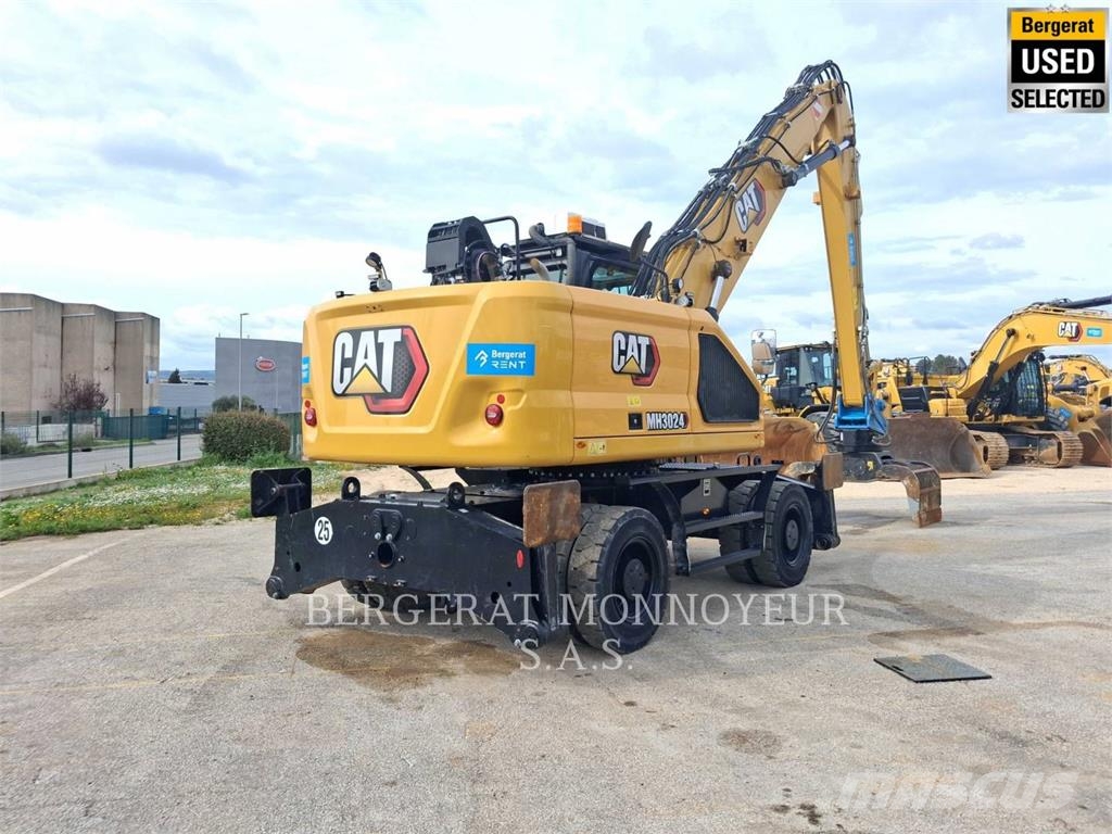 CAT MH3024 Pelle sur pneus