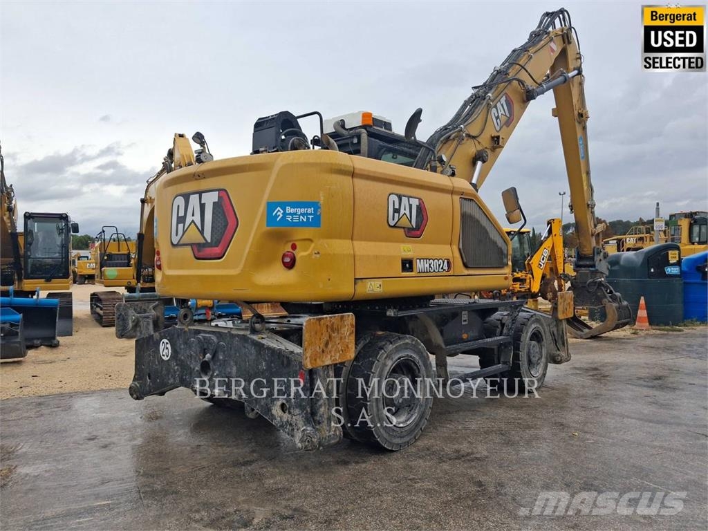 CAT MH3024 Pelle sur pneus