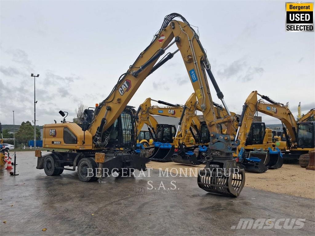 CAT MH3024 Pelle sur pneus