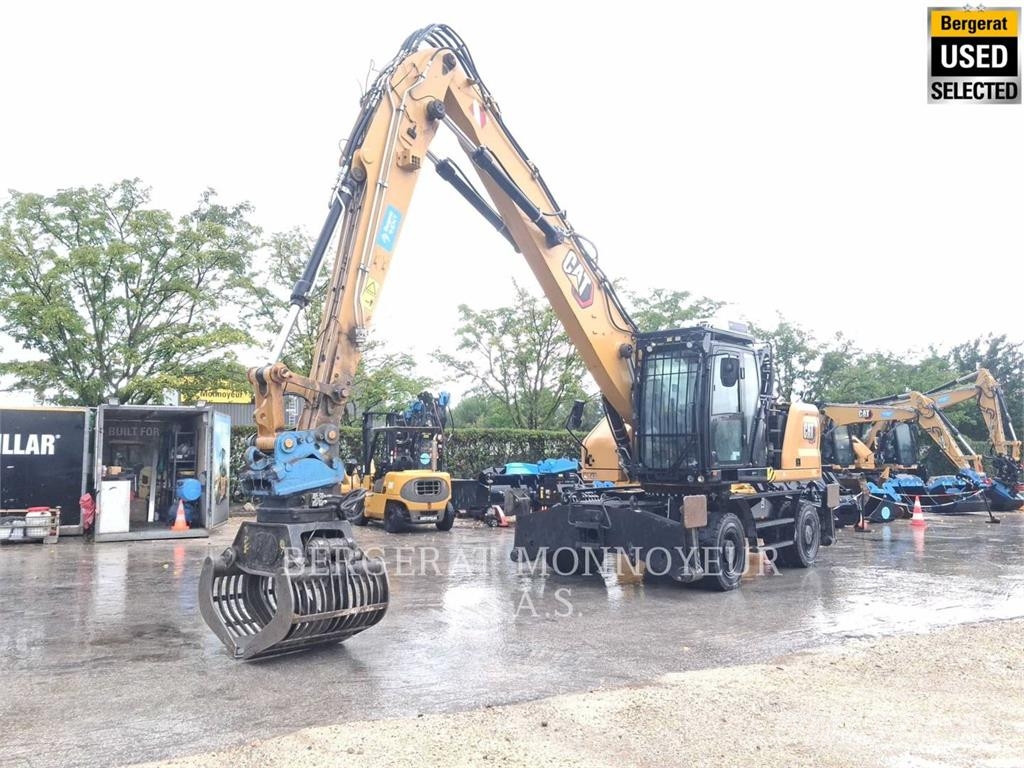 CAT MH3024 Pelle sur pneus