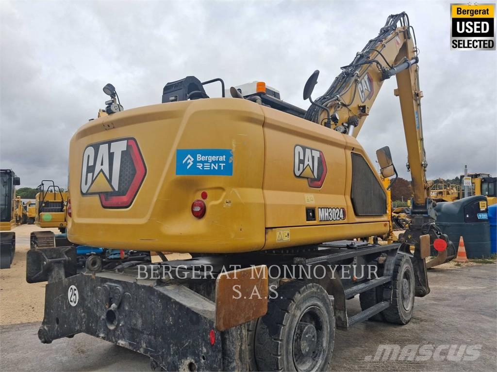 CAT MH3024 Pelle sur pneus