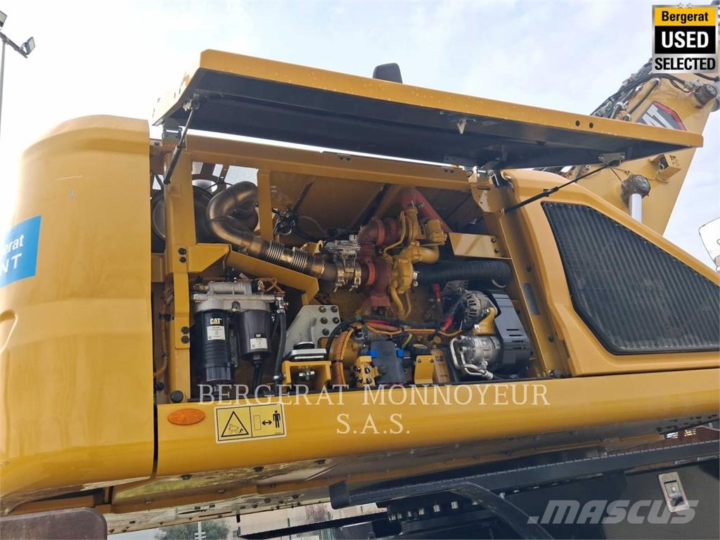 CAT MH3024 Pelle sur pneus