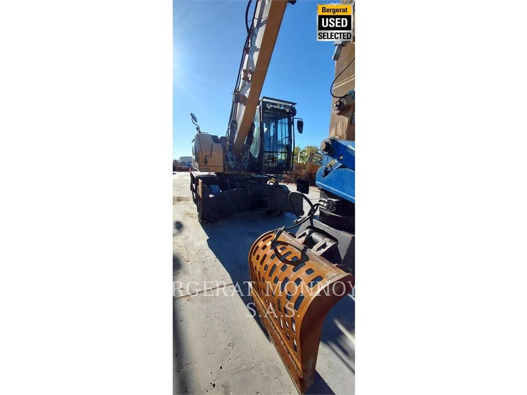 CAT MH3024 حفارات بعجل