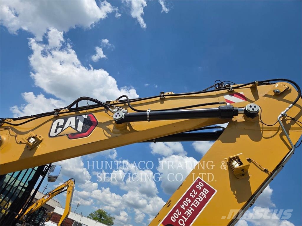 CAT MH3024-07 حفارات بعجل