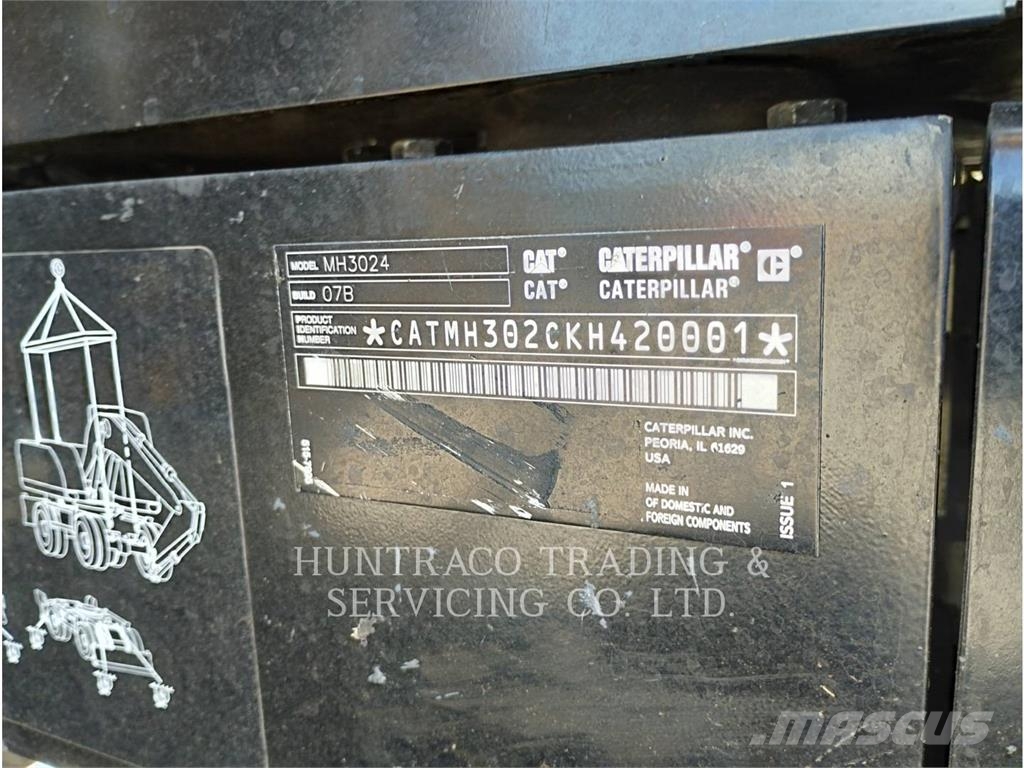 CAT MH3024-07 حفارات بعجل
