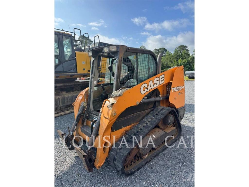 New Holland TR270B لوادر انزلاقية التوجيه