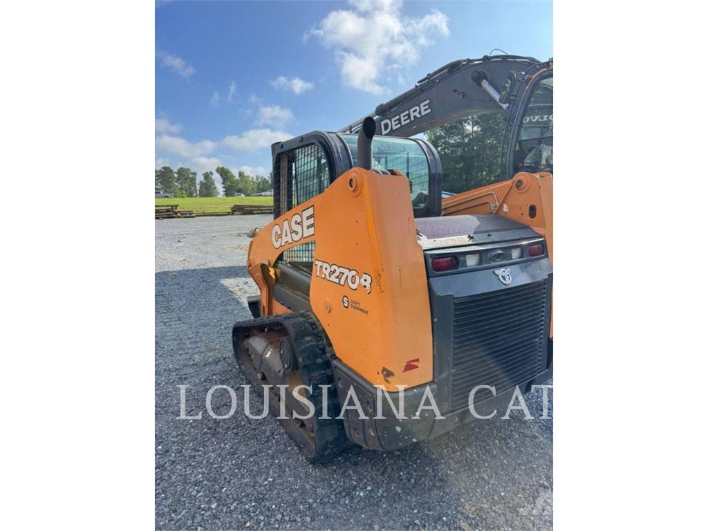 New Holland TR270B لوادر انزلاقية التوجيه