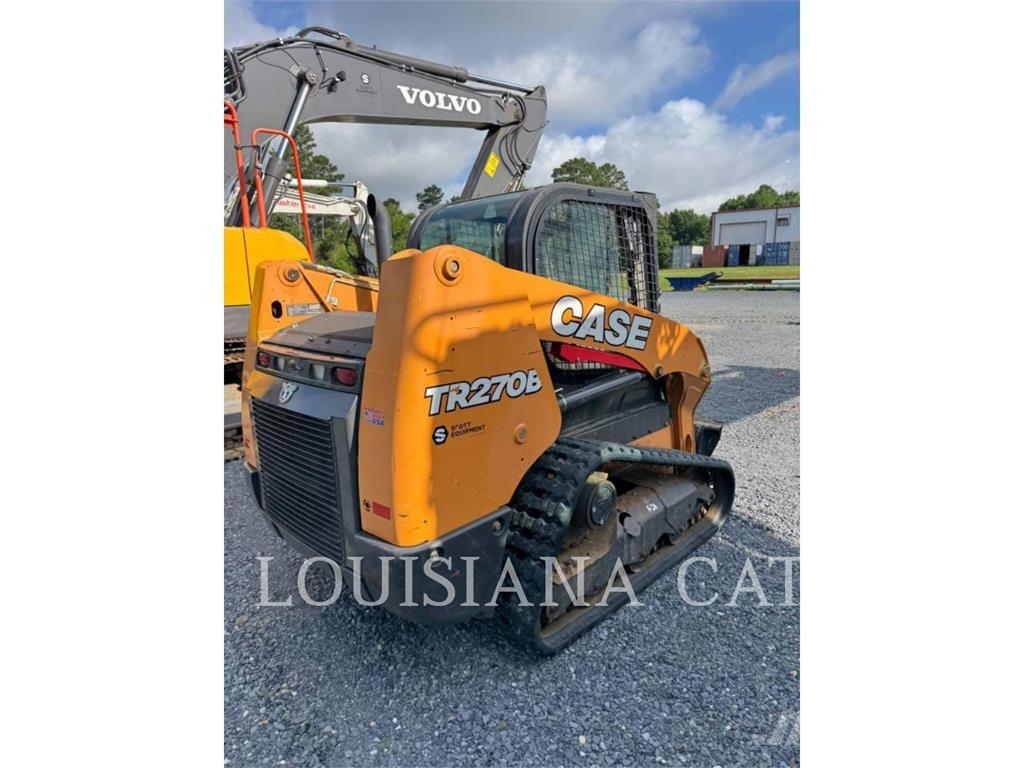 New Holland TR270B لوادر انزلاقية التوجيه