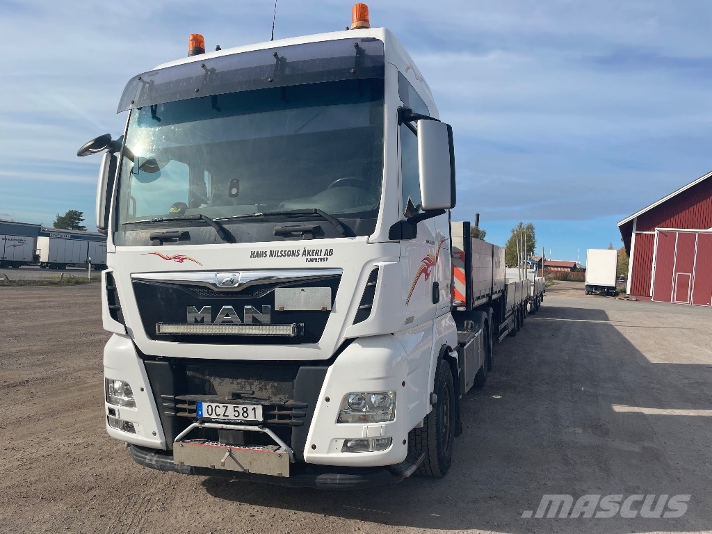 MAN TGX 33.560 6x4 BLS Camioane platforma/prelata