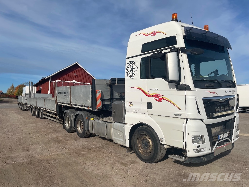 MAN TGX 33.560 6x4 BLS Camioane platforma/prelata