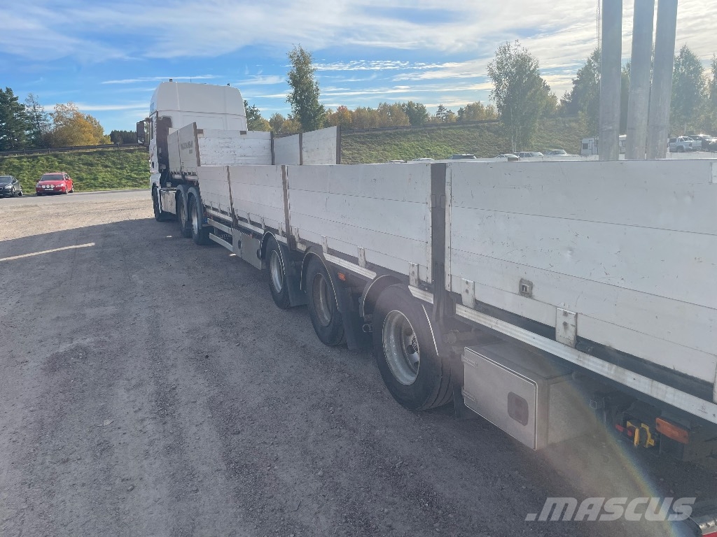 MAN TGX 33.560 6x4 BLS Camioane platforma/prelata
