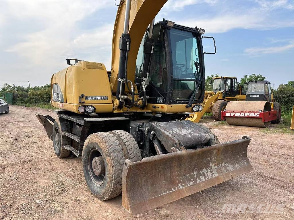 CAT M320D wheel excavator Pelle sur pneus