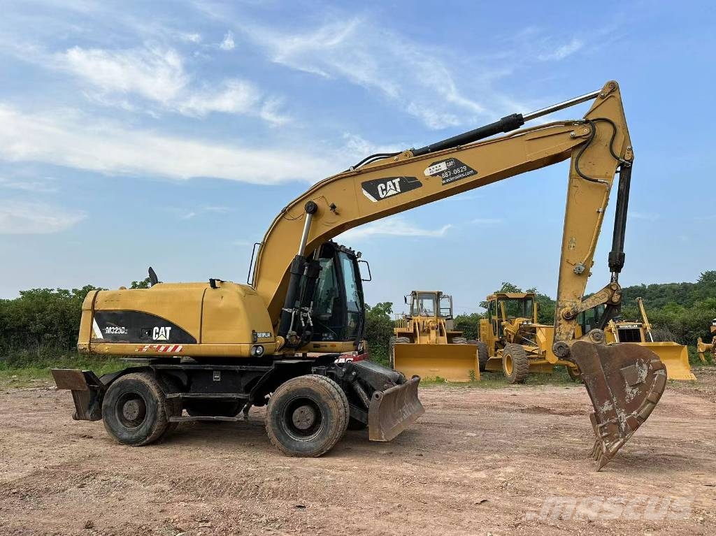 CAT M320D wheel excavator Pelle sur pneus
